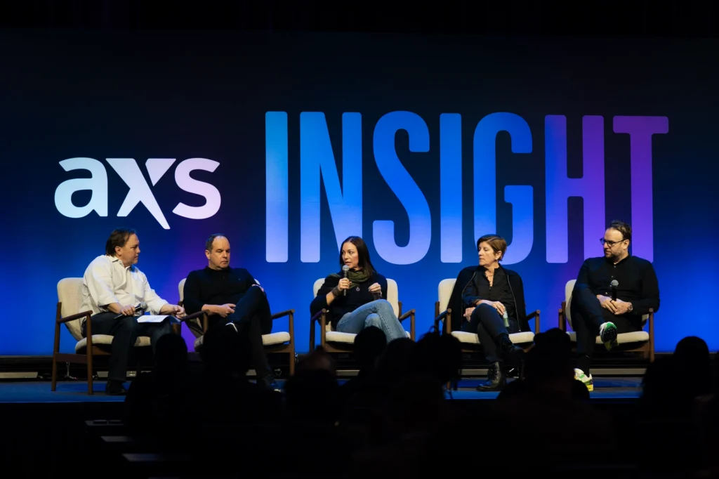 Panelists on stage during AXS Insight 2026.