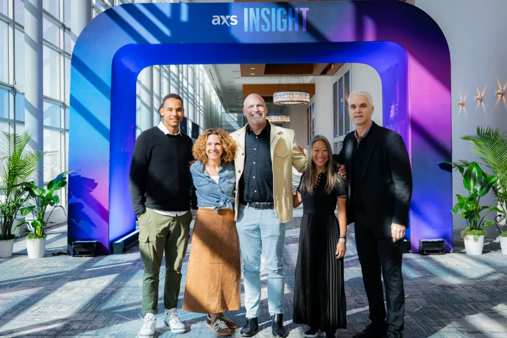 Panelists and attendees of AXS Insight